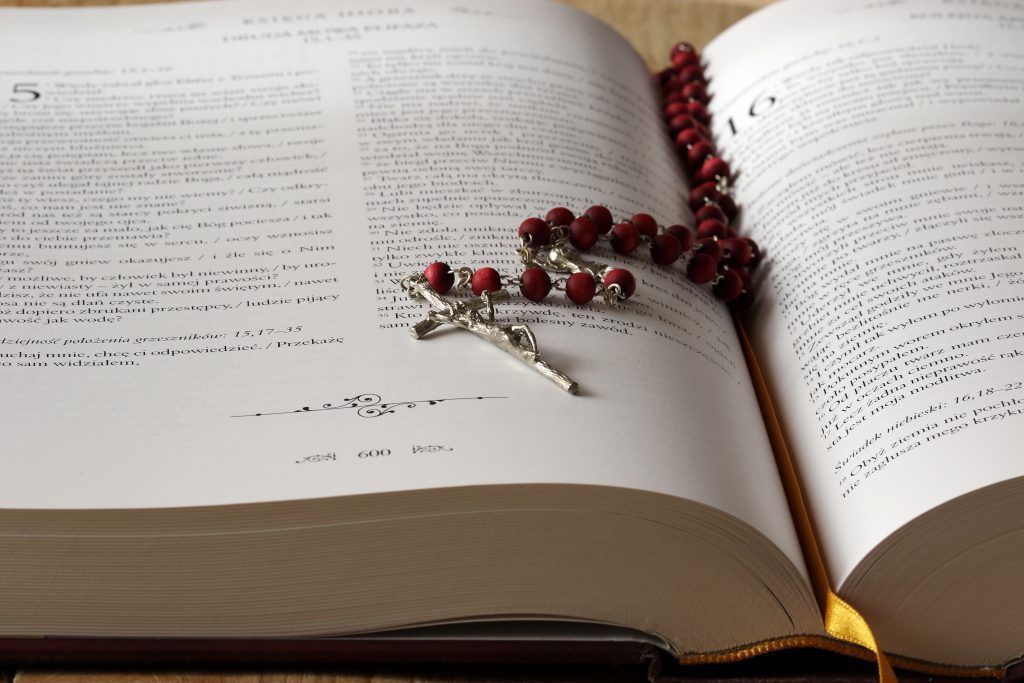 Rosary beads on open bible